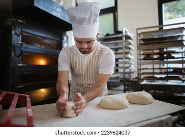 Young baker with down syndrome preparing pastries in bakery. Concept of integration people with disabilities into society. - Powered by Shutterstock