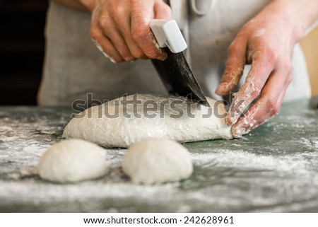 Similar – woman kneading bread dough with her hands