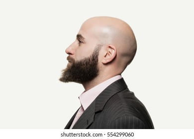 Young bald man with a beard wearing a stylish jacket