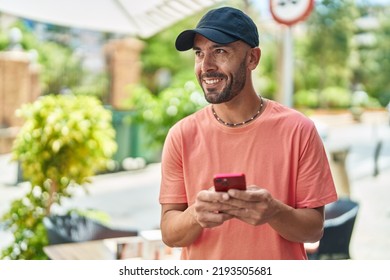 Young Bald Man Smiling Confident Using Smartphone At Street