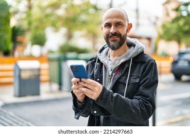 Young Bald Man Smiling Confident Using Smartphone At Street