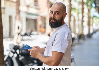 Young Bald Man Smiling Confident Using Smartphone At Street