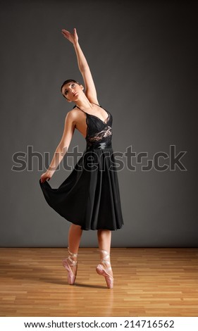 Young ballerina in black costume