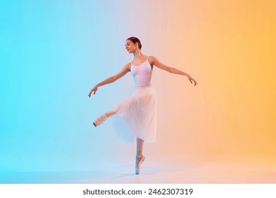 Young ballerina in white tutu an pointe practicing dance moves in neon light against blue-orange gradient background. Concept of art, movement, classical and modern fusion, beauty and fashion. Ad - Powered by Shutterstock