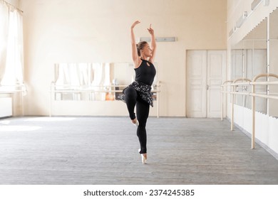 young ballet dancer doing solo practice performance in the dance studio - Powered by Shutterstock