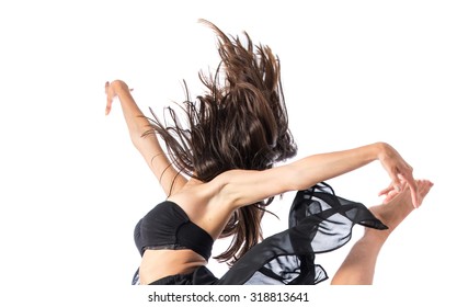 Young Ballet Dancer Jumping Over White Background