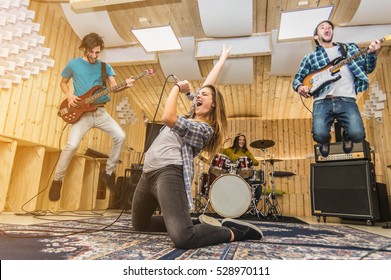 Young band music playing a song in a recording studio