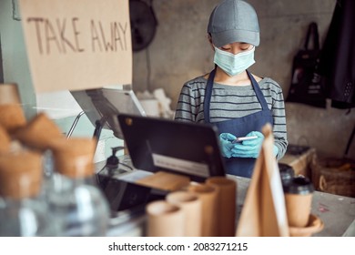 Young Barista Is Standing Behind Bar Counter