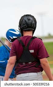 Young Baseball Boy Catching Behind Home Plate.