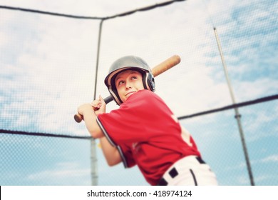Young baseball player batting