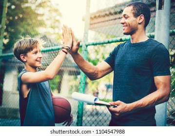 Young Basketball Player And His Coach