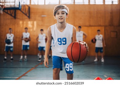 A young basketball player wearing jersey number 99 looks ready for action on an indoor basketball court, reflecting a love for sports and physical activity - Powered by Shutterstock