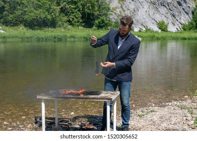 Young Bearded Guy, Hipster In A Jacket Overworked. And Burned The Office In A Fit Of Rage. Office Worker Decided To Quit Work, Because He Hates Office Work.