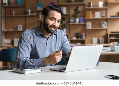 Young Bearded Indian Business Man Teacher Talking, Teleworking, Having Virtual Classroom Meeting Working On Laptop Computer Giving Online Webinar Training, Remote Class On Video Conference Call.