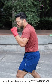 Young Bearded Latino Exercising In A Park In Mexico City.