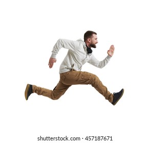 Young bearded man in casual clothes is shot in mid-air jump isolated over white background
