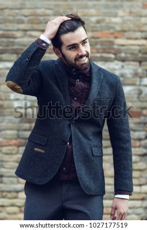 Similar – Guy with beard and modern hairstyle in the street.