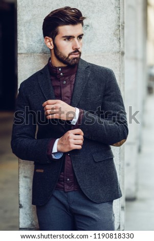 Similar – Thoughtful young man sitting on an urban bench