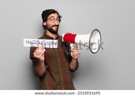 young bearded man protesting with a megaphone