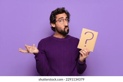 young bearded man with a question mark