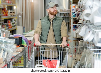 Young Bearded Man With Shopping Cart Visiting Hardware Store