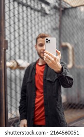 Young Bearded Man Taking Photo Selfie, Video Chat In The Street