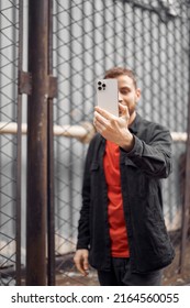 Young Bearded Man Taking Photo Selfie, Video Chat In The Street