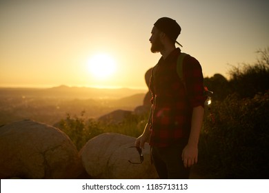 Young Bearded Millennial Man Hiking On Top Of Hill In California Over Looking San Diego At Sunset