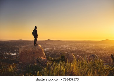 Young Bearded Millennial Man Hiking On Top Of Hill In California Over Looking San Diego At Sunset