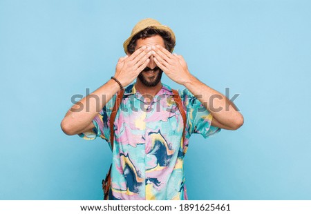 Similar – Man observing something through binoculars