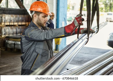 Young Bearded Worker In A Hardhat And Protective Uniform Working At The Metal Factory Copyspace Profession Occupation Engineer Builder Manufacturing Operating Concept