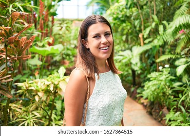 Young beatiful woman smiling happy and cheerful at butterfly garden on a sunny day of summer - Shutterstock ID 1627364515