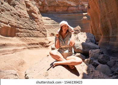 Young beauitufl hiker woman trekking natural orange mountain on summer holidays - Shutterstock ID 1546130423