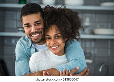 Young Beautiful African American Couple Sharing A Hug.