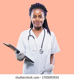 Young beautiful African American girl doctor in a white coat with a stethoscope