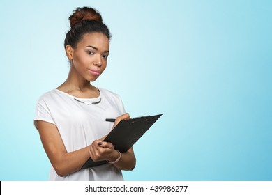 young beautiful african american woman with clipboard