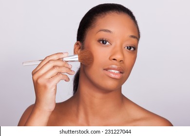 Young Beautiful African Woman Applying Makeup - Black People