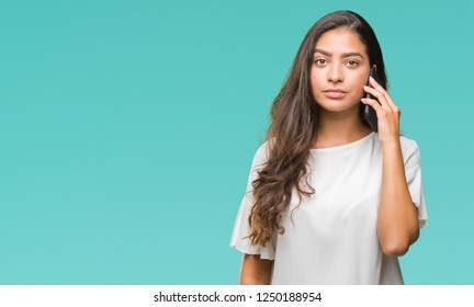 Young Beautiful Arab Woman Talking On The Phone Over Isolated Background With A Confident Expression On Smart Face Thinking Serious