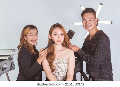 A Young Beautiful Asian Actress Or Celebrity Idol With Her Makeup Artist And Hairstylist Backstage At The Studio.