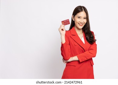 Young Beautiful Asian Business Woman Wearing Red Suit Smiling, Showing, Presenting Credit Card For Paying Online Business Isolated On White Background