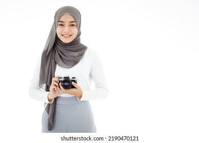 Young Beautiful Young Asian Islamic Businesswoman Holding A Vintage Camera. Muslim Women Concept With Hobbies And Art Photography.