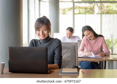 Young Beautiful Asian Smiling Businesswoman Working In Startup Office, Happy Work Concept