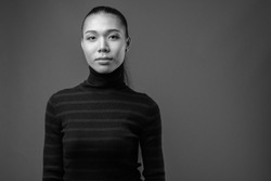 Young beautiful Asian transgender woman in black and white, a Person Photo by Ranta Images