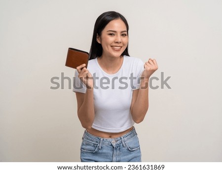 Young beautiful asian woman with brown wallet on isolated white background. Financial and investment concept. Rich Business asian woman counting money in wallet.