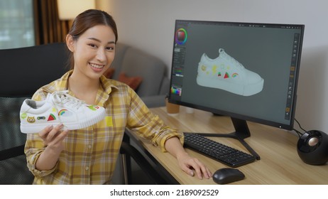 Young Beautiful Asian Woman Designer Showing Her Sneaker Design To Camera. She Using 3d Program To Design Her Sneaker. Fashion And Designer Concept.