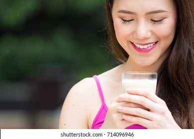 Young Beautiful Asian Woman Drinking Milk, Soy Milk Outdoor, Healthy Drinking And Food For Woman Concept