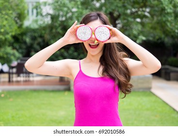 Young Beautiful Asian Woman Eating Dragon Fruits, Healthy Eating With Clean Food And Fruit For Diet Contact