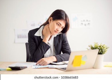 Young Beautiful Asian Woman Feeling Hurt,fatigue, Pain At Neck, Muscle During Working With Laptop In Coffee Shop Cafe, Stretching Arms And Body For Relaxing, Vintage Tone, Office Syndrome Concept