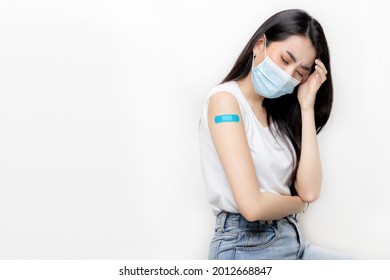 Young Beautiful Asian Woman Having Painful Head Ache. Vaccine Allergy Effect After Received Vaccine With Copy Space.