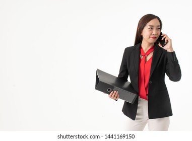 Young beautiful Asian woman holding phone and portfolio to presents to her boss for interviews. she hope to get a new job. White background - Copy space.